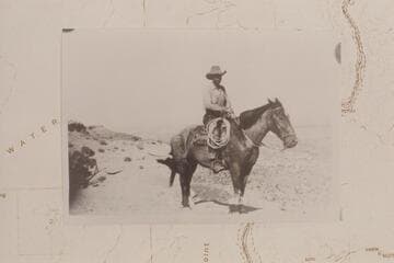 Ned Chaffin mounted on Fox.  On Black Ledge above Teapot Canyon which carries the name Calf Canyon on the Quad