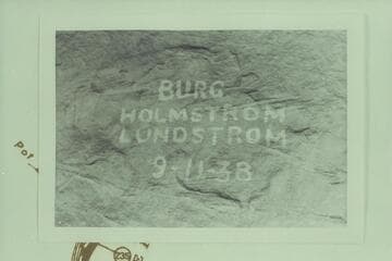 This photo is captioned: "Above Harp--Left Side--Lodore." Names at left bank at Mile 234.15 in Canyon of Lodore. Holmstrom marked his map "Wrote our names 5:45 PM 9-11-38."