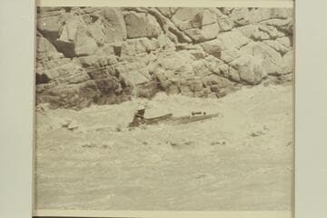 Dock Marston struggling to push the "Esmeralda II" up 217 Mile Rapid with its 75 HP inboard engine