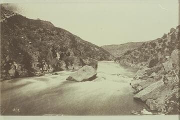 Ashley Fall, Red Canyon, Green River. Ashley's name was found on right of picture on one of the huge fallen rocks, about at the top of the old dead tree.Marked on back "481, Hillers." More likely it was made by Beaman