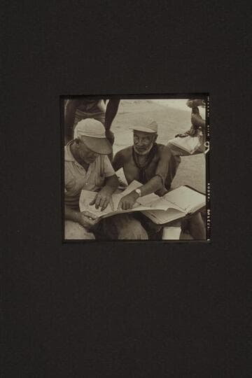 Rod Sanderson is briefed by Marston for the run from Diamond Creek to the head of Lake Mead. Diamond Creek Camp