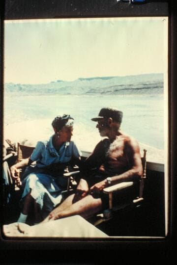 Margaret Marston explains to Dock some of the rim activities during the June 1957 outboard cruise of the Grand Canyon