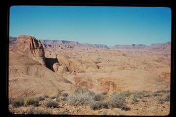 Across 73 and down Glen Canyon from top of Black Brush Mesa; Butte is between northeast fork and middle fork