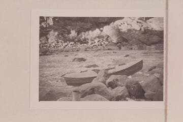 Buzz Holmstrom's boat being portaged at Vulcan Rapid