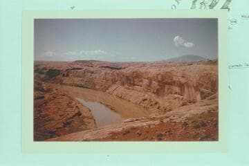 Lake Powell about to submerge "Poor Man's Placer". From the top of the cliff at Mile 109 3/4. Navajo Mountain at right