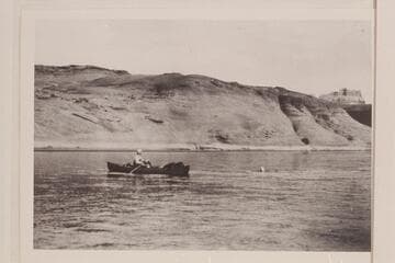 Sarah Fraser swimming across the river at El Vado. Burt Loper in rowing the folding canvas boat. Photo copied from album of Sarah Fraser Robbins