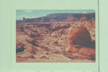 Down canyon at Mile 74. Across Glen Canyon to Lion Rock at left; Fifty Mile Mountain at upper center and Sixty Mile Point at upper right