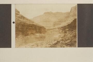 Down from Rapid 293; about Mile 119 at end of bend around Powell Plateau