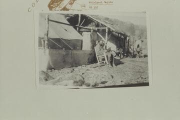 Camp for Placer operations on Gretchen Bar. Johnson is center, Andy is watching