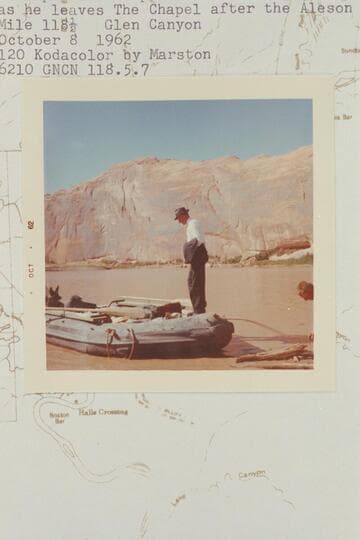 Bishop Wells steps into Ken Sleight's inflated boat as he leaves The Chapel after the Aleson wedding. Mile 118.5, Glen Canyon