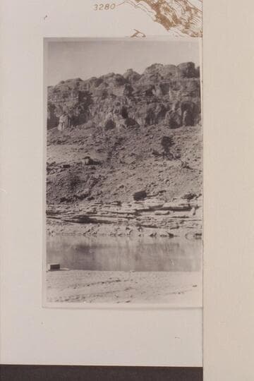 Oil sand directly across river from seeps Waterpocked Fold. Note Wingate in cliffs above