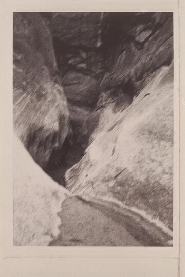 Down Anasazi Canyon into pool which demands wading below the joint entry into Canyon