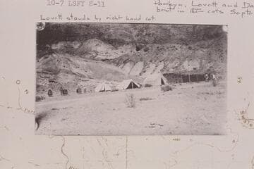 First camp set up on north side of river at Lees Ferry by American Placer Corporation. The fort was used as a cook house. The three cots at left were brought in by Chicago men