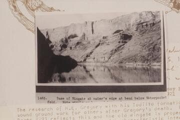 Base of Wingate at water's edge at bend below Waterpocket Fold. Note middle member and top member with arches