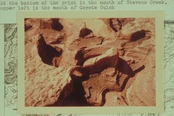 Stevens Canyon (Skyline) Arch. At the bottom of the print is the mouth of Stevens Creek. At upper left is the mouth of Coyote Gulch