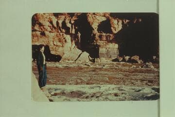 Susie Reilly looking at the rocks in Paria Riffle