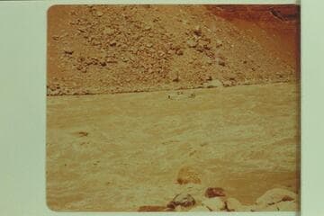 Larry Sanderson piloting the "Cactus" through Hance Rapid