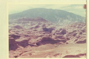 Across the cactus flat drained by Black Water Creek and the small dry stream bed at Mile 71. Butte 6069 at left above center. Butte 5014 at right center