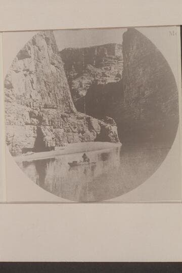 Beauty and Calm--A quiet stretch between rapids.  The boat is one of those used during the Swain-Hatch traverse of the Marble and Grand Canyons in 1934
