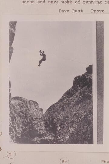 Israel Chamberlain riding a shieve [sic] on Rusts Cable.  Method in common use to take one person across and save work of running cage.  Winter