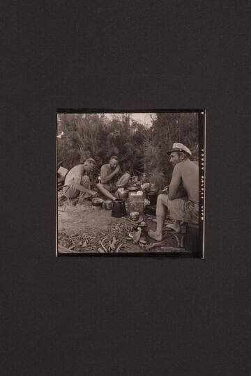 Willie Taylor and Bill Belknap at the cooking while Ole Claude Nichols is busy worrying