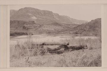 Cable anchorage at Lees Ferry.  The buildings of the Spencer Mining operation and the fort are right center