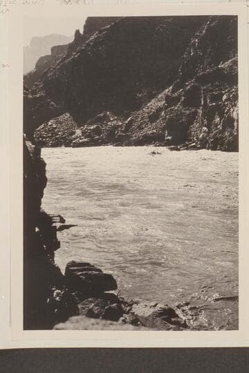 The "Marble" in No. 55 rapids, 9 miles below Diamond Creek. Kolb- boatman