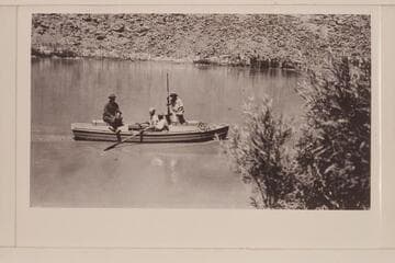 The "Grand" launched at Lees Ferry.  The four boatmen are aboard.  Left to right:  Freeman, Lint, Blake, and E. D. Kolb.  Lint album