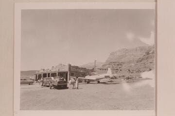 Various transport media to be found at Art Greene's. Cliff Dwellers Lodge on the highway west of Marble Canyon Bridge. The motor car is towing the motor boat which is about to make a traverse of the Grand Canyon