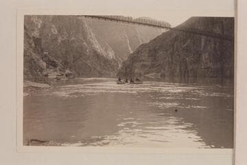 Wrangler and dudes catching crabs from the Pathe-Bray skiff "Bright Angel" in the eddy below the suspension bridge