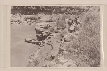Repairing boat after accident; Rapids; splitting boat. 14 M. below Honaker Trail