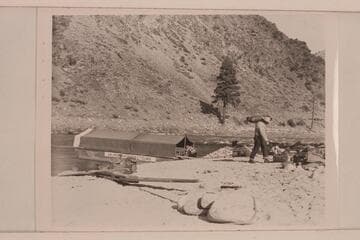 The scow with tent rigged for the night. The sweeps are on the beach