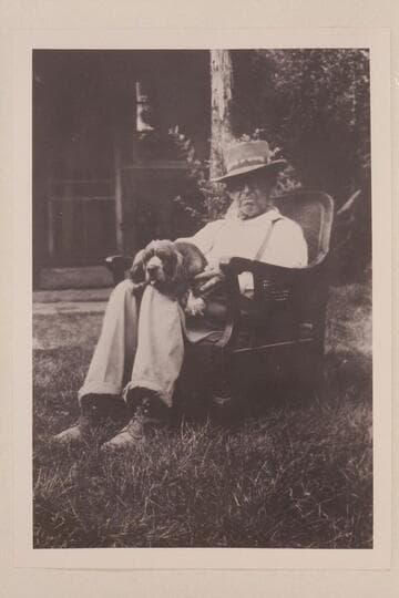 Doc Inglesby in chair used by Julius Stone in Glen Canyon trip of 1938.  The dog is "Judy."