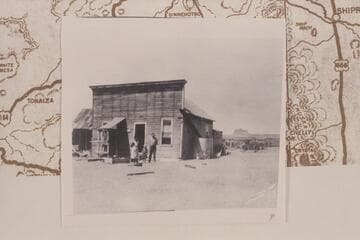 Home and store of the Arthur H. Spencer family at Mexican Hat showing the family standing in front
