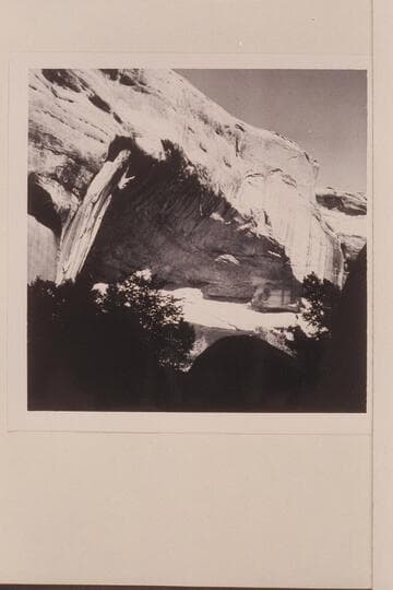 Large cave in upper Surprise Valley.  A few small ruins are in this cave and it has an inscription on one of the boulders:  M.A.SMITH/O.B.LUNDAHL/7/16/08