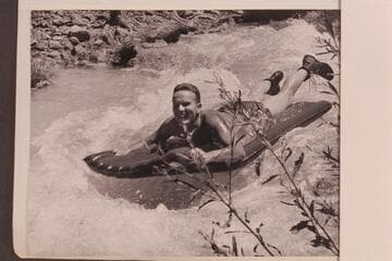 Bill Belknap gets some early training in running rapids. Riding Havasu Creek on an air mattress
