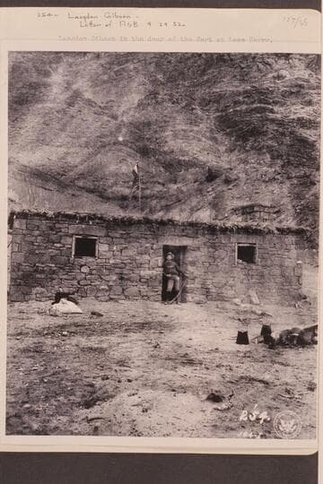 Langdon Gibson in the door of the fort at Lees Ferry. Gibson was a member of the Stanton crew which traversed Marble and Grand Canyons