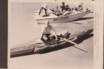 Alexander "Zee" Grant and his kayak "Escalante" in which he made a transit of the Grand Canyon in 1941.  The two Nevills sadirons are in the background