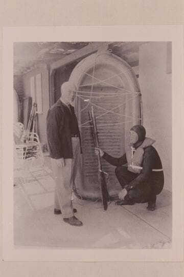 Dock Marston and Bill Belknap with Sportyak used in 1964 transit of Cataract Canyon. News photo with Polaroid camera