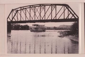 Steamboat "City of Moab" at Green River Bridge. The "City of Moab" was propelled by marine gasoline engines operating twin screws