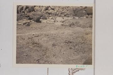 Skiff of the Dusty Dozen dropping into the hole near right bank of 85 Mile Rapid. The boatman has been rowing bow first and facing the stern so is handicapped by turning to see what is ahead of him