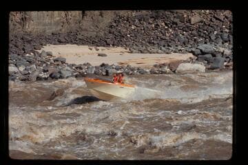 "Wee Red" climbing Dubendorff Rapids