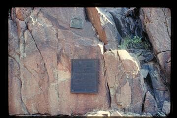 The plaque at Separation Rapid placed first near the edge of the river and removed--1934-1939, and the plaque to replace it which was placed in 1939 by Julius Stone and party. The first plaque was placed a second time 1971, Nov. 27