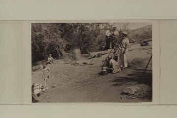At left, Sandra Nevills walks down to christen the sadiron named for her.  Lees Ferry.  Dock Marston stands at the camera tripod