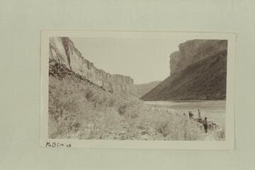 Looking upstream at Soap Creek camp on Colorado River. The Bus Hatch pontoons at the beach. Lees Ferry gauge: 26,200 cfs