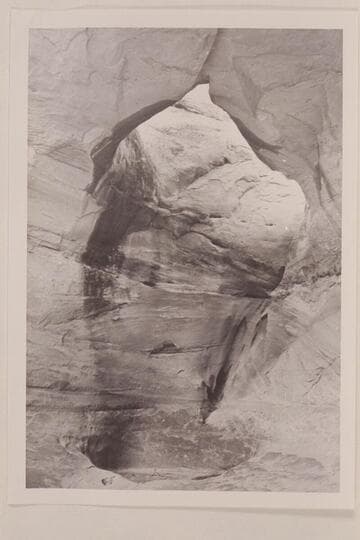 Ba-Sah Bridge, Navajo Canyon.  Note the large pot-hole directly below the bridge.  There is a deep pool of water with surface about six feet below the rim
