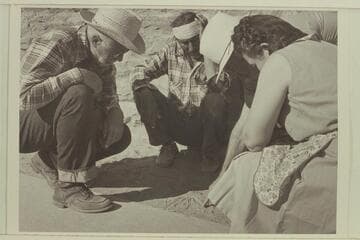 Sketching out the country in Navajo Canyon before riding into it. Masland at left and Madaleine Cameron at right, Navajo Indian and Marston in rear; at Navajo Mt. Trading Post