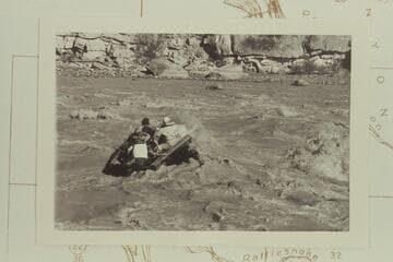 George Stewart's 10-man, powered with a 6 HP Merc, and with John at the controls, drops into Coal Creek Rapid off course to the right and trying to get back to the left