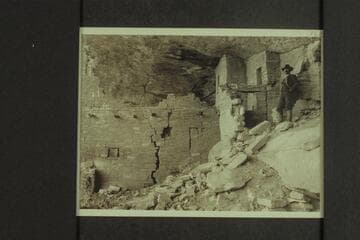 A glimpse into the interior of one of the houses.  Note the cracked walls and cedar logs built in--used probably to support a walk or balcony