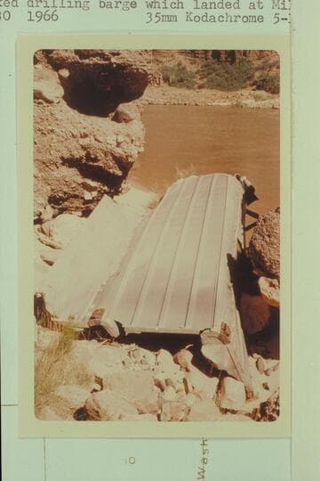 Wrecked drilling barge which landed at Mile 193 in 1948